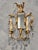 Enhance the ambiance of your living space with this exquisite antique Italian sconce. The elegantly designed tole gilt...