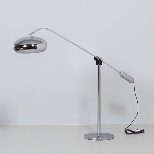 Chrome space age floor lamp from the 1970s with an adjustable cantilever arm, ideal as a statement piece in a modern...
