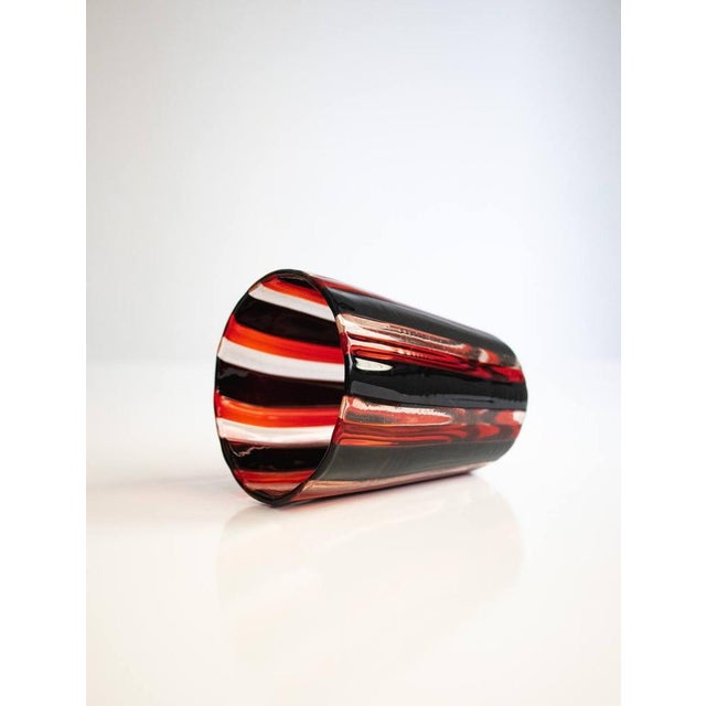 Astonishing drinking set in colored Murano canes made by Angelo Ballarin for Ribes Studio. Our glasses all look alike but...