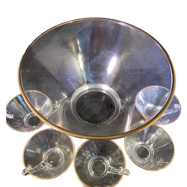 Quick Hits Piece Name: Glass Punch Bowl and Five Punch Glasses Style: Hollywood Regency / Art Deco Materials: Glass with...