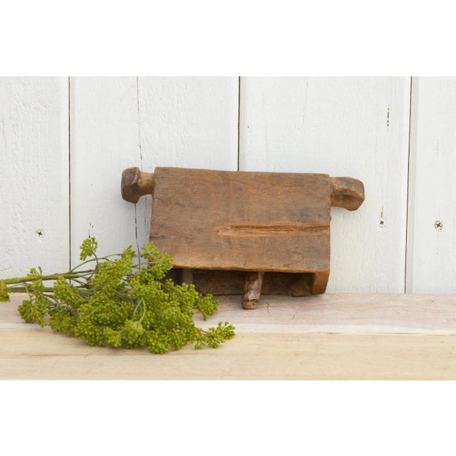 A charming antique artifact from Nepal, this antique cowbell was hand-carved from native wood. The rustic cowbell has two...