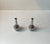 Small pewter vases with long neck and 'fish mouth'. Designed and manufactured by Just Andersen in Denmark during the...
