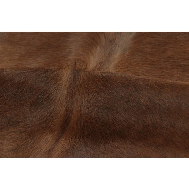 This 7x8 contemporary cowhide rug is an exciting new addition to Rug & Kilim’s Modern collection—a naturally shaped animal...