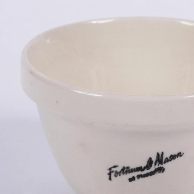 This small vintage creamware bowl has Fortnum & Mason of Picadilly printed on the front. Signed by Maker