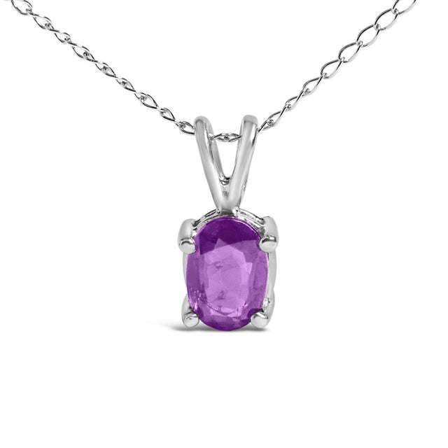 Elegance distilled into a mesmerizing piece, this pendant necklace crafted in 14K white gold features a sensual 6x4mm...