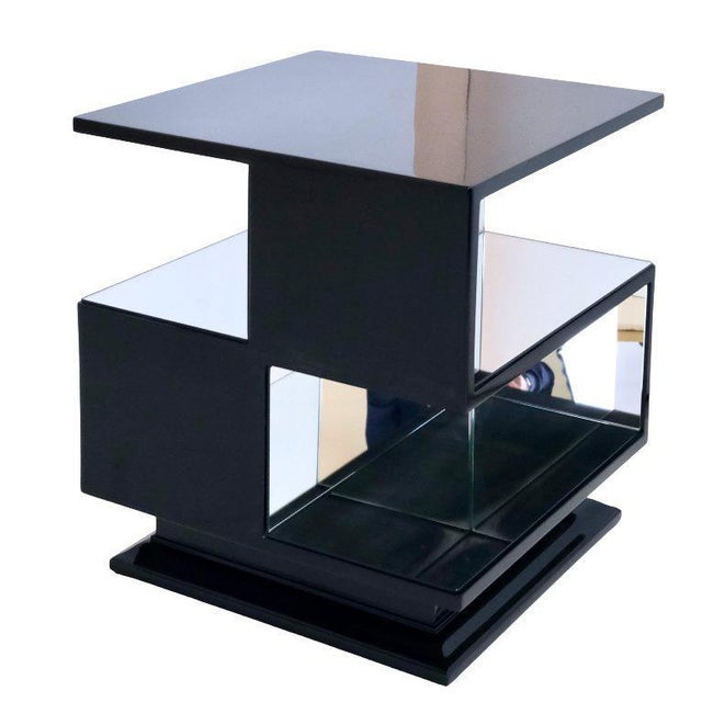 Cubist mirror table Art Déco France around 1930. Black lacquer with mirror glass. Meander shape – strict early style. On...