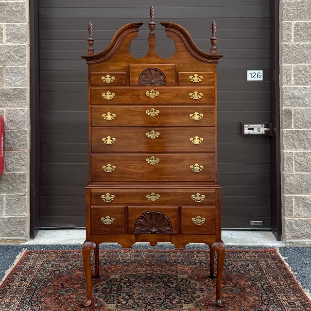 A vintage Statton Private Collection Traditional Queen Anne or New England style solid cherry highboy dresser having a...