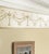 Adam's detailed Grecian urns are joined by garlands of leaves; creating a simple, pleasing, symmetrical design that looks...