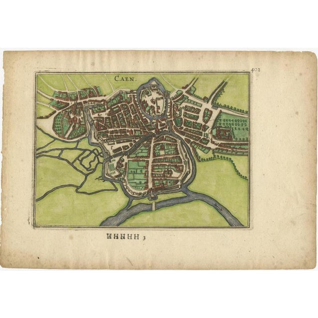 Caen – Antique Hand-Coloured Normandy Town Plan Engraving (1666) This 17th-century copper engraving offers a finely...