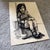Ruth Schloss (Israeli/German, 1922 – 2013) Full-length portrait of a young girl Ink on paper Signed in Hebrew along the...