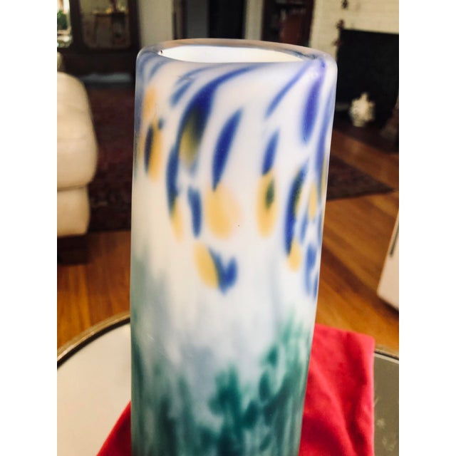 Tall, thin studio art glass hand blown vase is a colorful collaborative between artists glass blowers Faro and Powers....