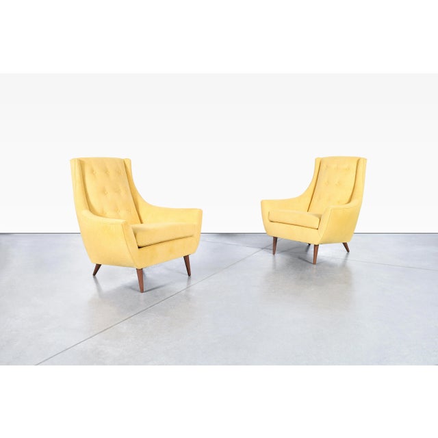 This striking pair of mid-century modern lounge chairs was manufactured in the United States during the 1960s and...