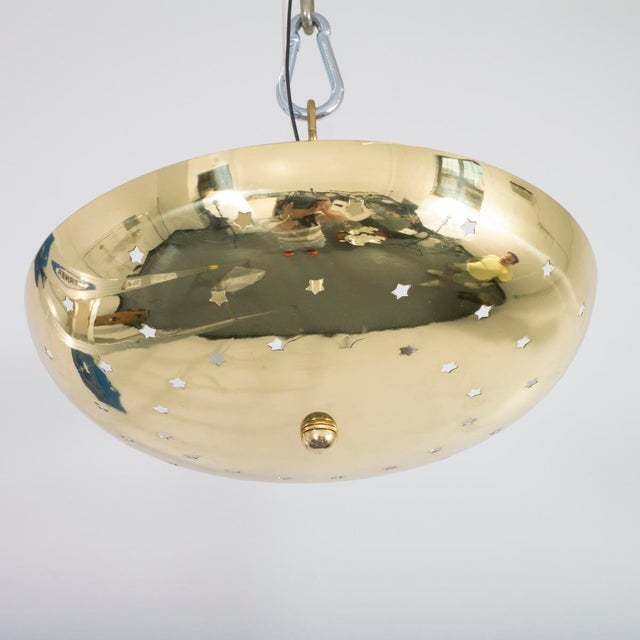 Perforated, polished brass "star" motif flush mount ceiling fixture. UL certified.