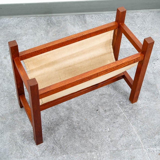 Danish solid teak magazine rack with a canvas sling. A simple and stylish design.