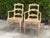 Vintage Louis XV-style carved accent chairs featuring beautifully shaped backs, carved floral details, curved cabriole...