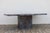 An exceptional 1970s Italian Postmodern dining table crafted entirely from richly veined Rosso Levanto marble. This...
