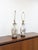 This lovely pair of vintage chinoiserie style table lamps with an off-white ground and delicate pink floral accents with...