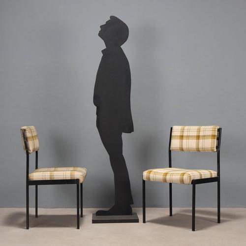 Chairs with enamelled metal frame, the padding is in foam, the upholstery is in fabric. This piece is attributed to the...