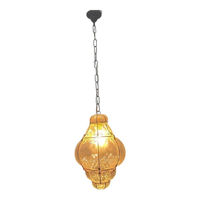 Wrought Iron Murano Glass Light Pendant 1960’s Mouth blown Murano glass encased in a wrought iron frame Height without...