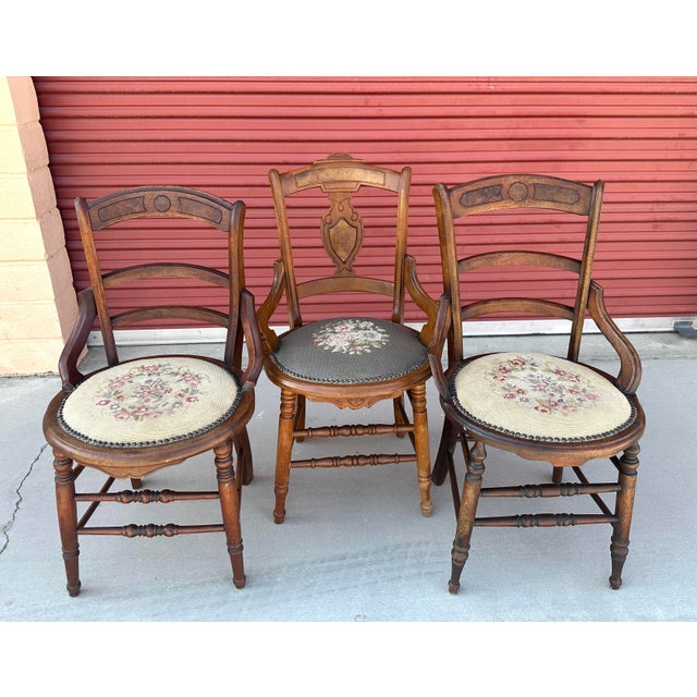 Set of 3 Antique 19th Century Needlepoint Chairs. Ladder back with nailhead trim around cushion seat. I have 2 that match...