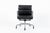 This authentic Eames for Herman Miller Soft Pad Management Height black leather office chair from the Aluminum Group...