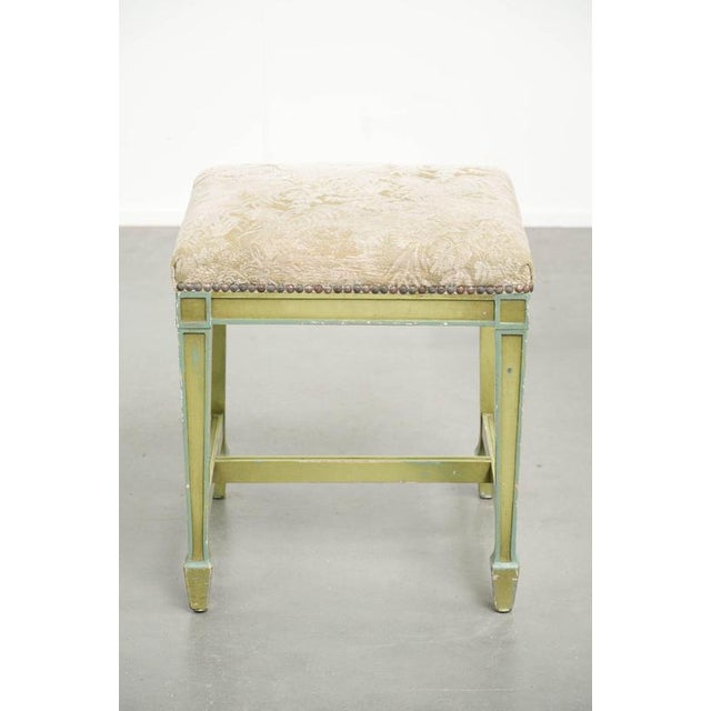 This antique Dutch wooden seat, which can also be used as a footstool or ottoman, dates from the early 20th century and...