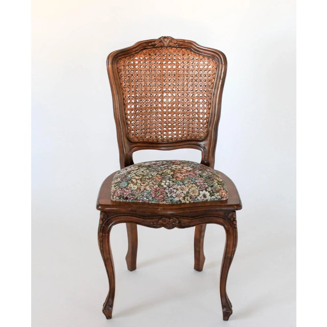 Beautiful vintage side chair with floral upholstered seat and double caned back rest. Made in Italy. Makers mark on the...