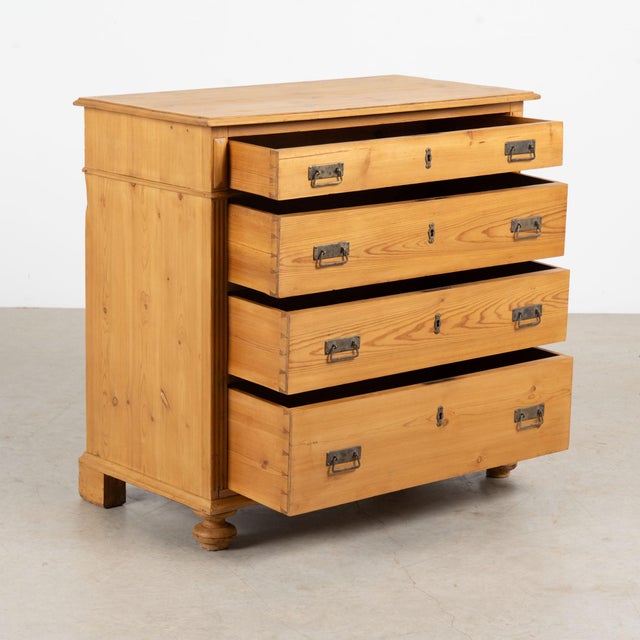 19th century Danish chest of four drawers, crafted in pine with a simple graduated form. The upper drawer is the smallest,...