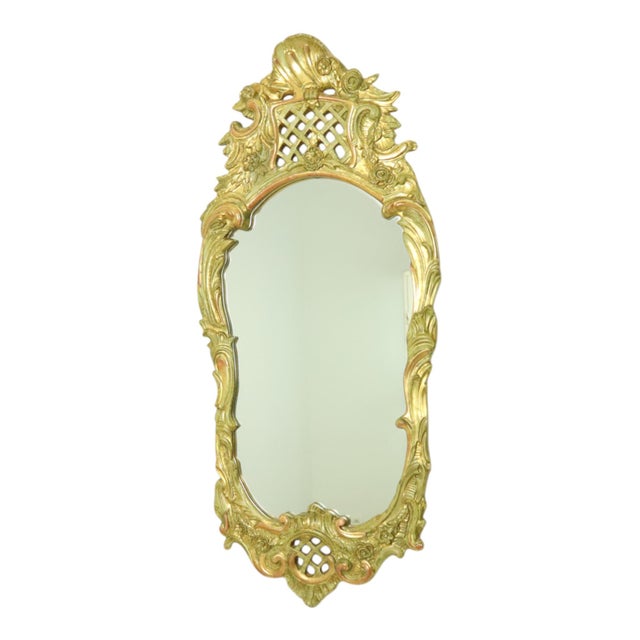Large Swedish mirror made of wood gilded with gold leaf, a classic crested mirror entirely in Rococo style, elegantly...