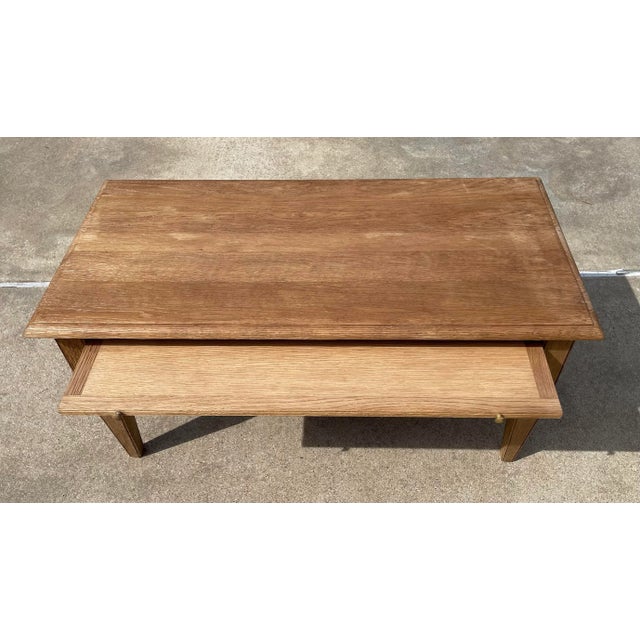 Wonderful MCM bleached oak coffee table with pull out tray and drawer - both can pull out from either side! Makers mark...