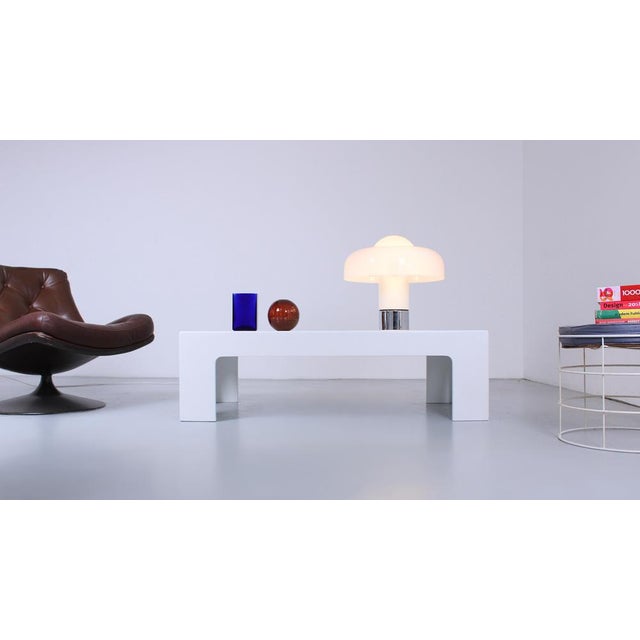 Characteristic 120 cm wide space age coffee table from the seventies. The thick legs, the rounded edges, the low height...