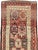 An antique Turkish Anatolian runner from the early 20th century. Anatolian, the rose-red field displays a geometric...