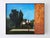 This oil on panel artwork captures a serene outdoor basketball court, framed by lush trees and a clear blue sky. The...