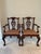 This traditional pair of mahogany arm chairs features a Chippendale style with hand carved backs and cabriole legs ending...