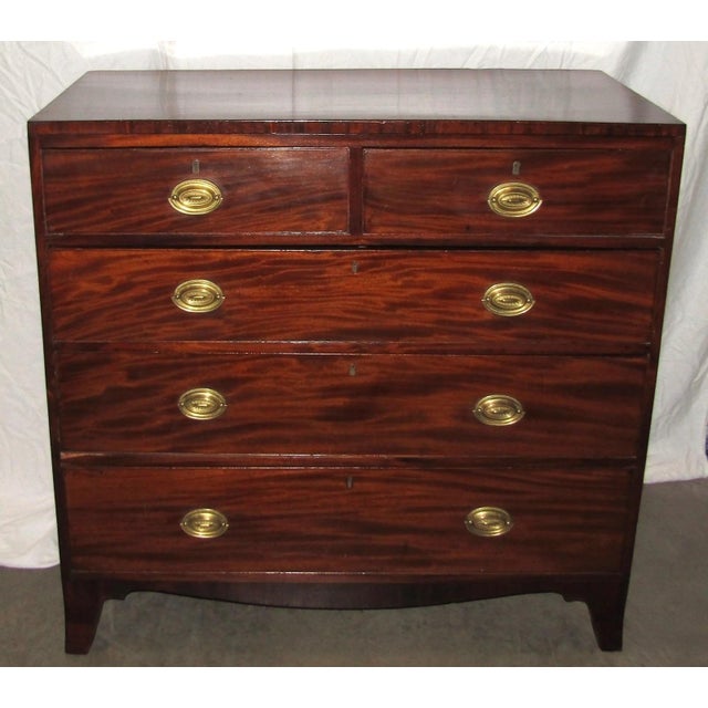 This early 19th century Federal Style Mahogany Chest of Drawers is a genuine antique piece that exudes American charm....