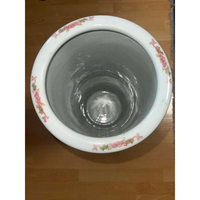 Striking and highly decorative, this monumental Chinese porcelain floor vase features a vibrant yellow ground richly...