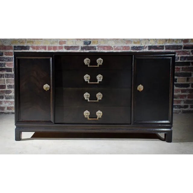 This buffet has four center drawers and 2 outside cabinet doors. It was manufactured by Landstrom Furniture of Rockford,...