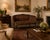 Elegant vintage Louis XVI Revival settee featuring a beautifully carved wood frame with a graceful curved barrel back,...