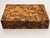 A striking vintage olive wood box featuring an intricate mosaic surface composed of individually arranged wood pieces in...
