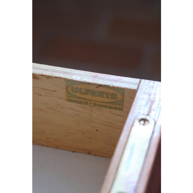 A matching pair of Scandinavian storage pieces from the 1960s, stamped Ulferts, Tibro, Sweden, inside a drawer. Teak...