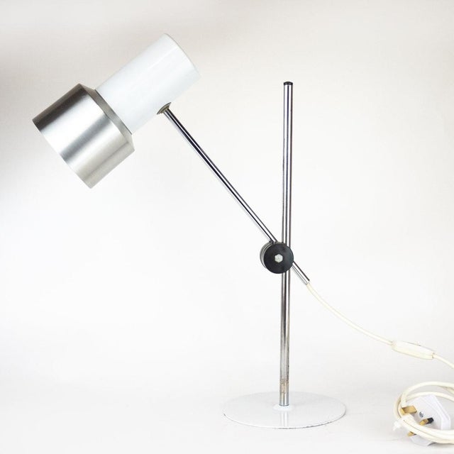 A 1960s Italian desk lamp by Prova. It features brushed aluminium and white colour. This piece is attributed to the...