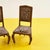 Discover timeless elegance with this pair of vintage wooden chairs ready for restoration, perfect for enhancing any room...
