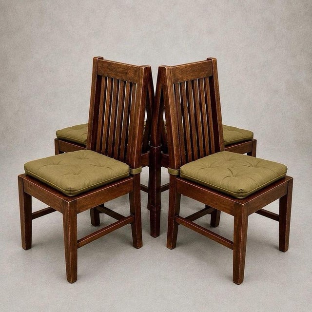 A substantial set of four 1990s dining chairs made from warm-toned mango wood. Tall slatted backs give the set a strong...