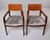 A refined pair of Art Deco style armchairs in figured mahogany, featuring beautifully grained back panels, angular open...