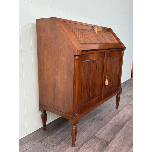 A refined flap-top secretaire (or writing desk), inspired by the Louis XVI style but arguably part of mid-20th-century...