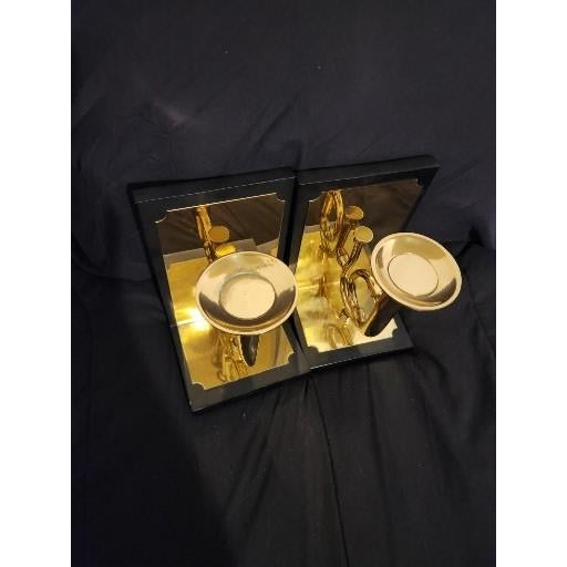 An exquisite and pristine pair of limited-edition trumpet sculptural bookends by the renowned luxury decor house Sarreid...