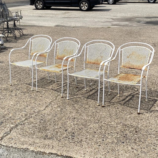 Vintage Mid Century Modern Wrought Iron Sculptural White Outdoor Patio Stacking Dining Arm Chairs - Set of 4. Circa Mid...
