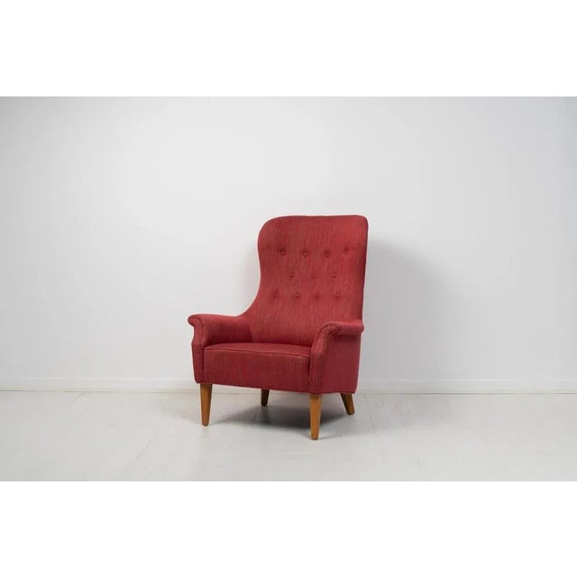 Scandinavian modern armchair by Carl Malmsten from Sweden made during the mid 20th century, around 1960 to 1970. The...