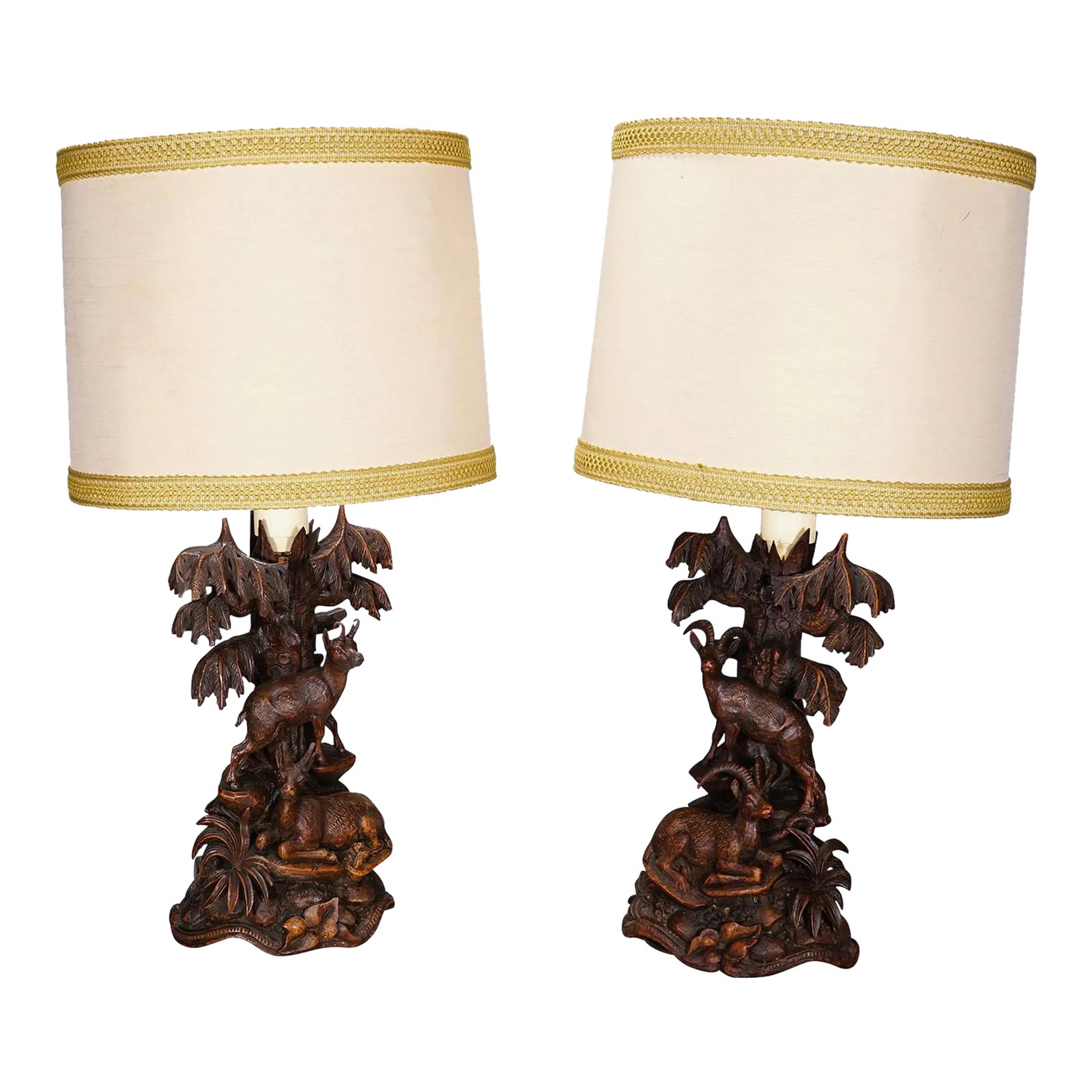 Pair Black Forest Carved Table Lamps With Ibex and Chamois | Chairish