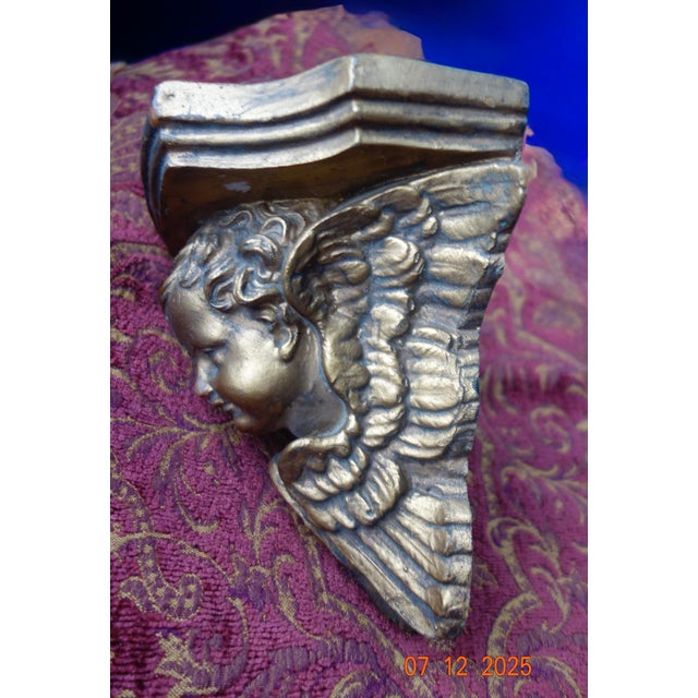 An old, hand carved and gilded cherub wall display shelf, Graceful, winged, worn, it needs nothing on it. Or. 6.5"wide,...